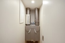 Heat Recovery Unit - fitted into a small storage cupboard.